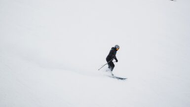 Skier in black jacket and black pants