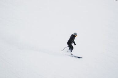 Skier in black jacket and black pants