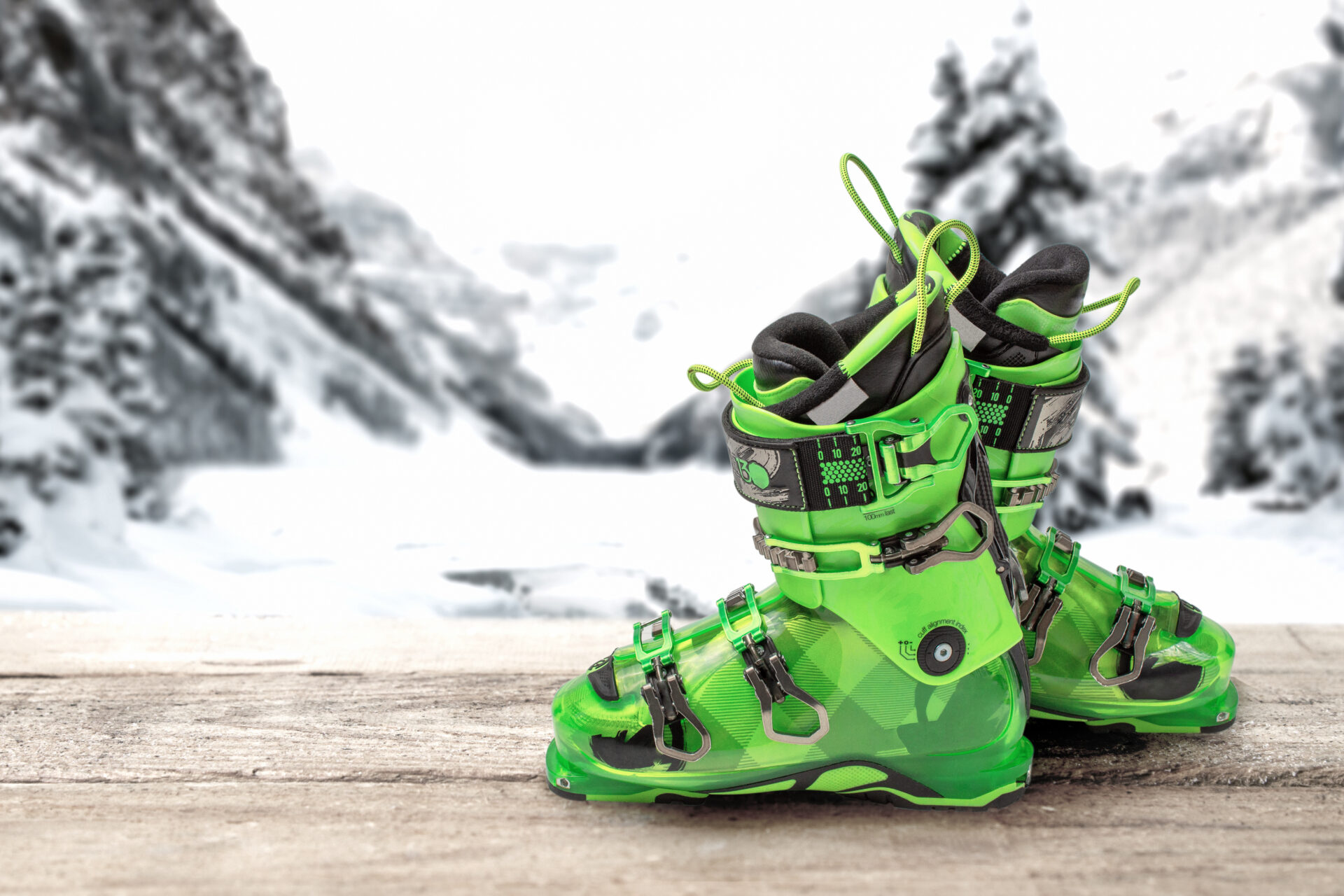 green ski boots on a table