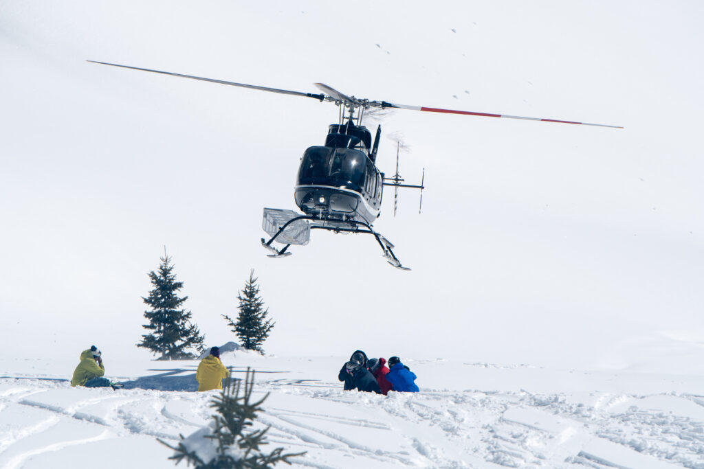 skiers heli skiing