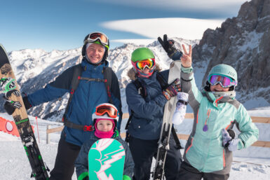 family skiing together