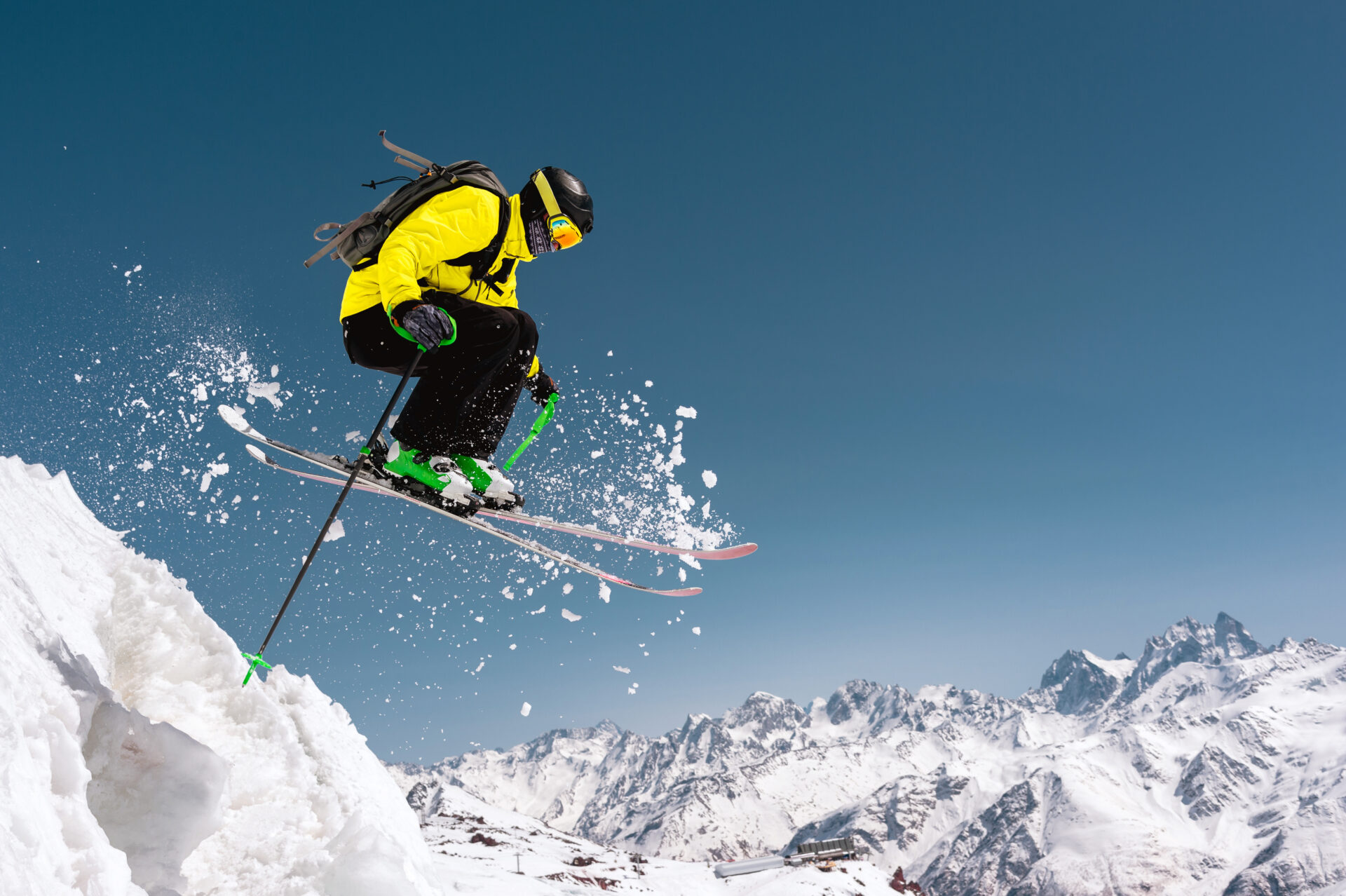 skier jumping off a cliff