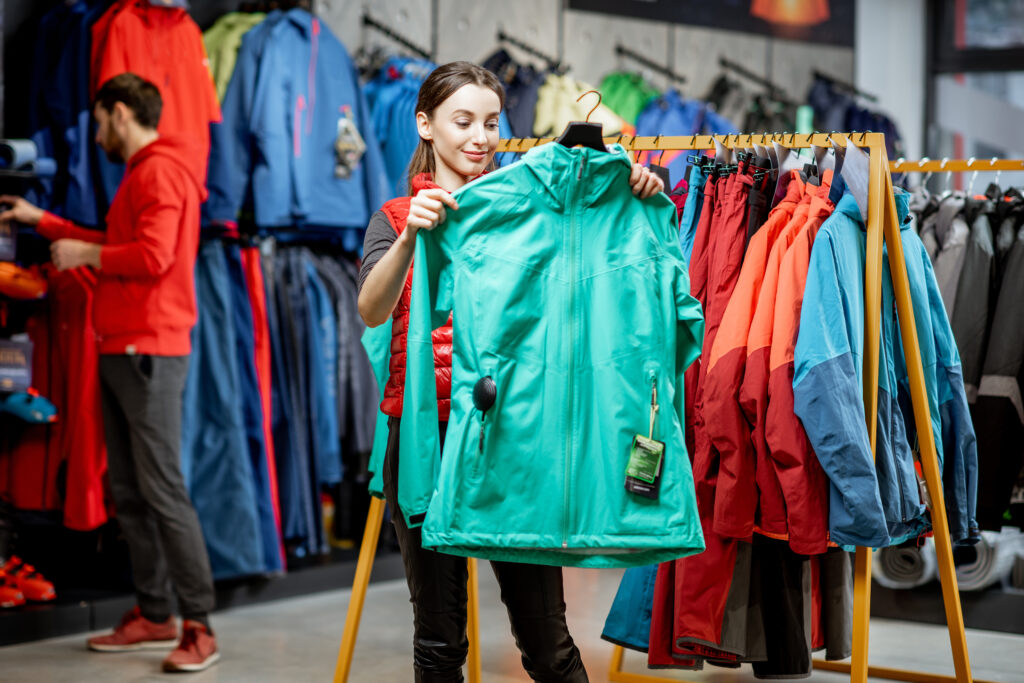 woman choosing a ski jacket