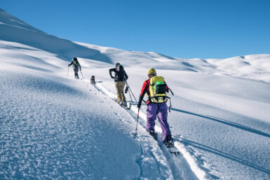 skiers going uphill